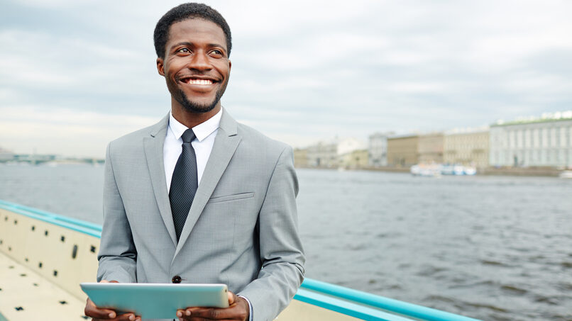 crew endorsement in Rwanda - black man in suit smiling