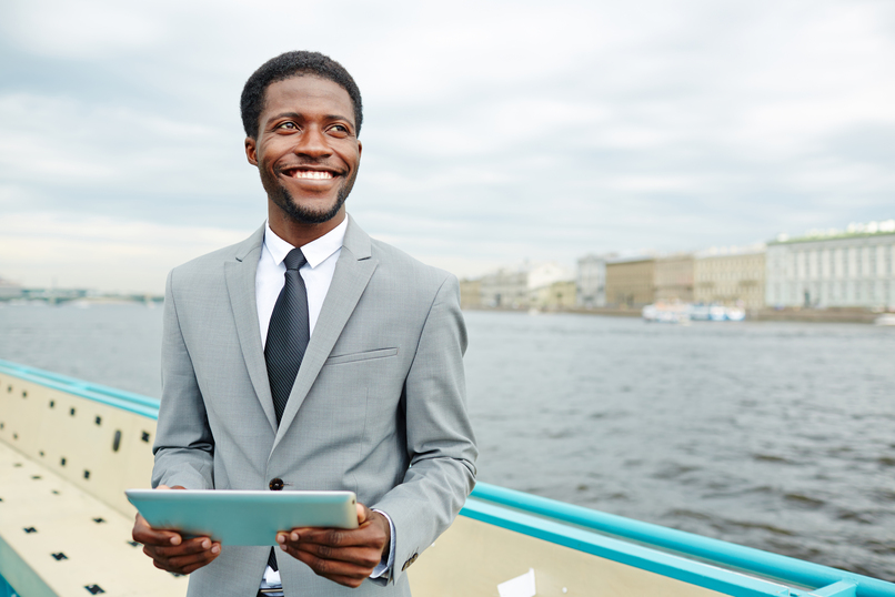 crew endorsement in cameroon - man in suit smiling