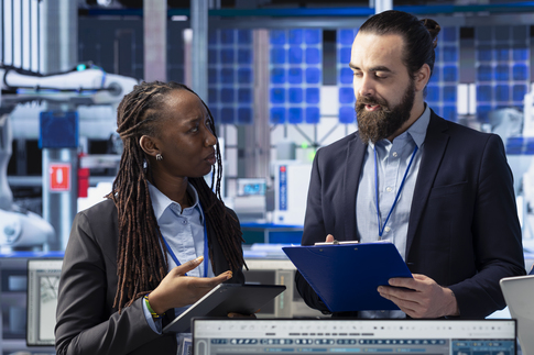 Obtain Call Sign - white man and black woman discussing